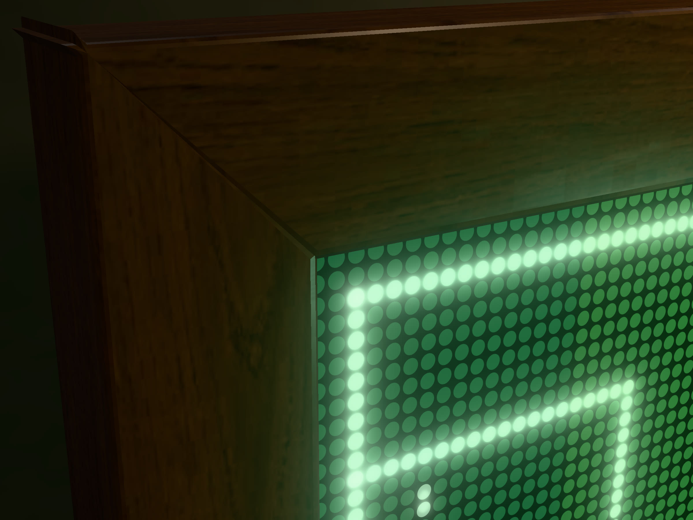 The walnut frame's mitred corner beside the lit LED dots.